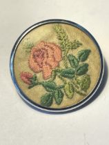 A VINTAGE EMBROIDERED BROOCH