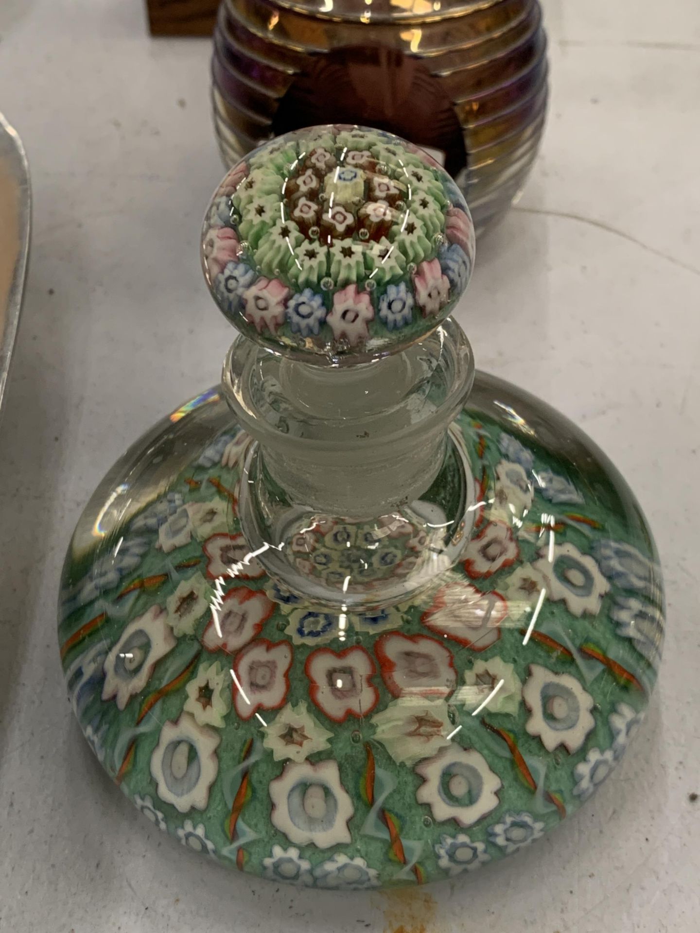 A MILLEFIORI GLASS PAPERWEIGHT INK BOTTLE WITH STOPPER