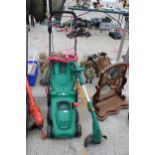 A QUALCAST ELECTRIC LAWN MOWER AND A BLACK AND DECKER ELECTRIC GRASS STRIMMER