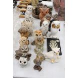 A COLLECTION OF SEVENTEEN OWL FIGURES PLUS A WALL PLAQUE