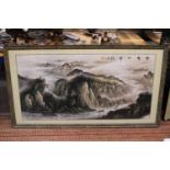 A VERY LARGE FRAMED CHINESE PEN AND INK WATERCOLOUR RIVER MOUNTAIN SCENE - 68 CM X 133 CM WITH