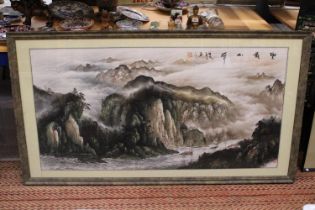A VERY LARGE FRAMED CHINESE PEN AND INK WATERCOLOUR RIVER MOUNTAIN SCENE - 68 CM X 133 CM WITH