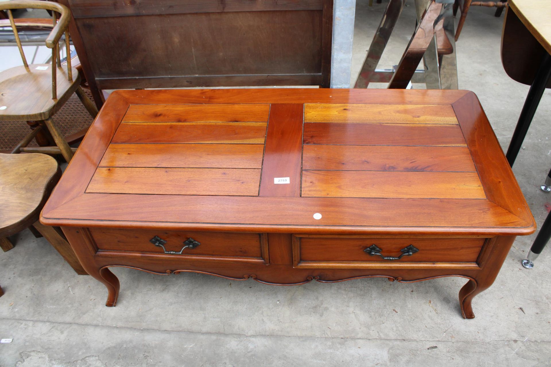 A MODERN HARDWOOD COFFEE TABLE ENCLOSING TWO DRAWERS, 47" X 23"