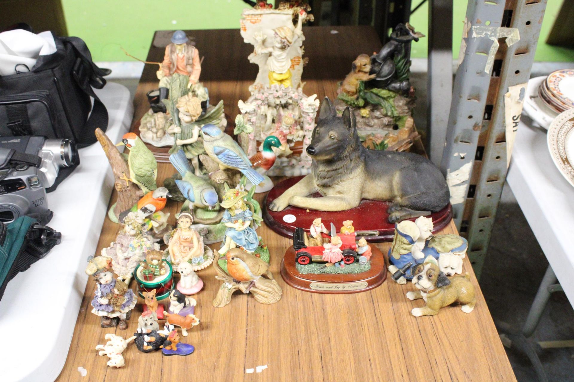 A LARGE QUANTITY OF ANIMAL AND BIRD FIGURES