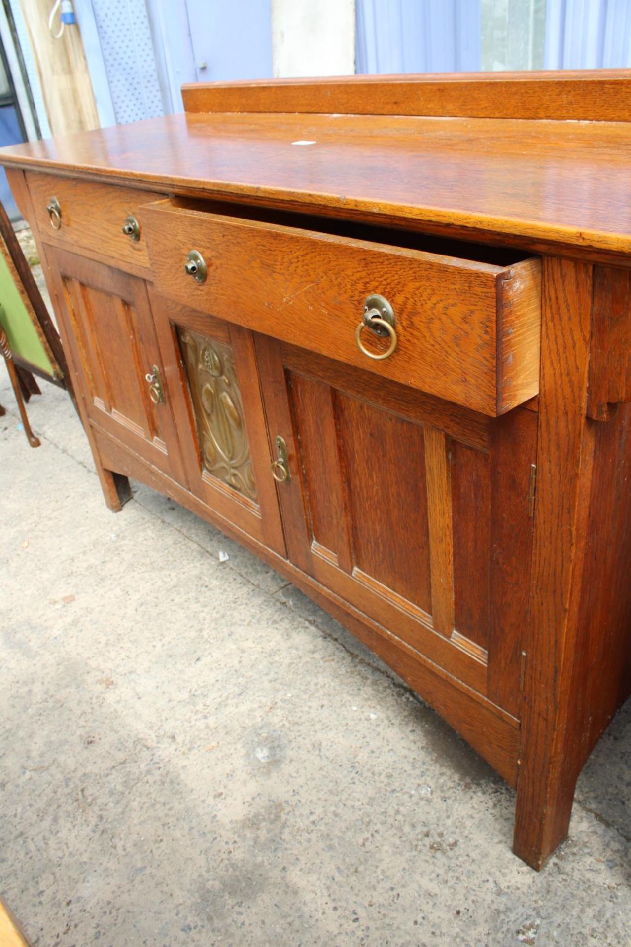 AN ART NOUVEAU OAK SIDEBOARD WITH CENTRAL EMBOSSED COPPER PANEL - 66" WIDE - Image 2 of 5