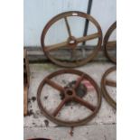 A PAIR OF VINTAGE CAST IRON TRAIN WHEELS