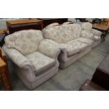 A MODERN FLORAL THREE PIECE SUITE WITH SIX LOOSE CUSHIONS