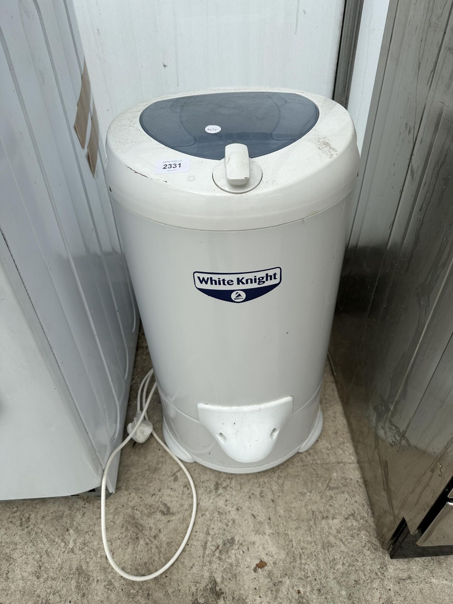 A SMALL WHITE KNIGHT SPIN DRYER