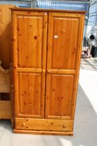 A MODERN PINE TWO DOOR WARDROBE WITH DRAWER TO BASE 37" WIDE