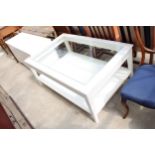 A MODERN WHITE TWO TIER COFFEE TABLE WITH INSET GLASS TOP 47" X 31"