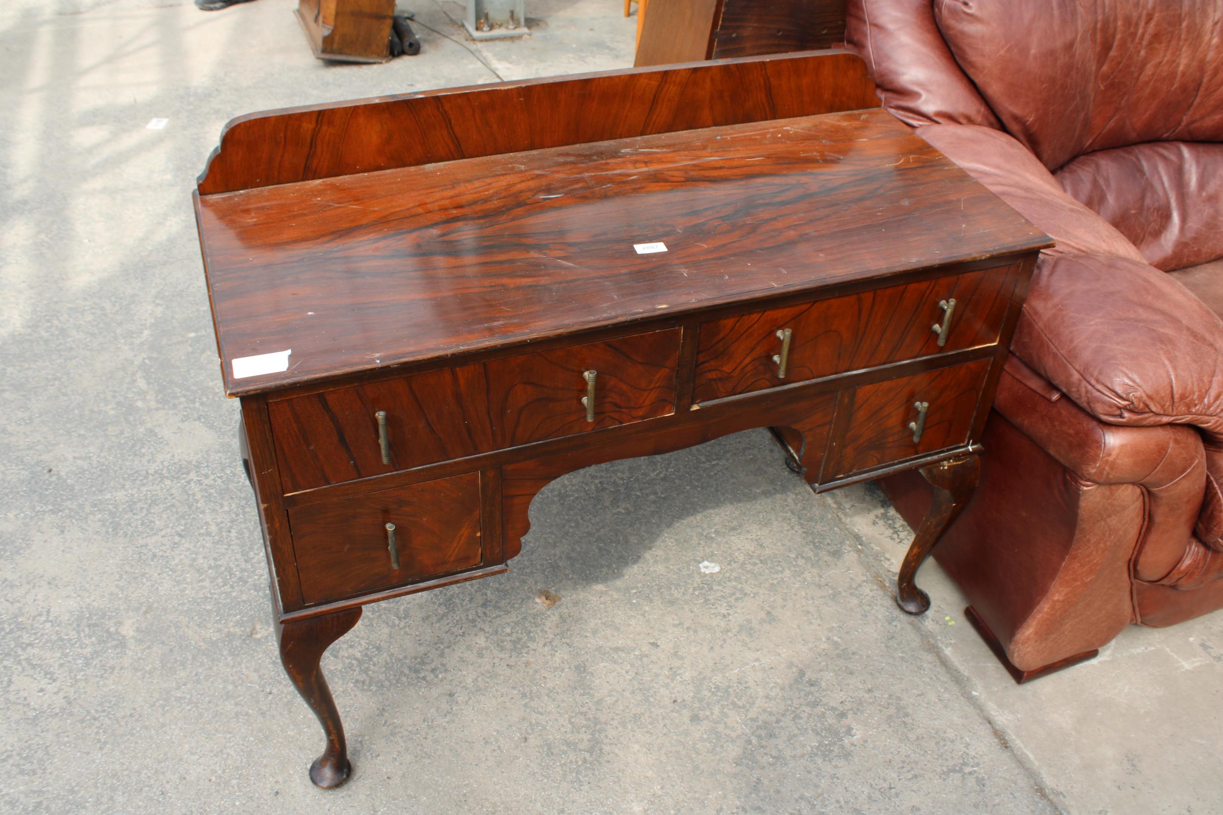A MID 20TH CENTURY WALNUT KNEEHOLE DRESSING TABLE BASE ON CABRIOLE LEGS, 42" WIDE