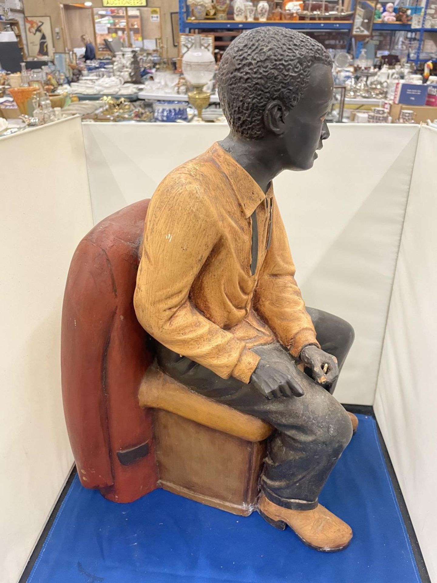 A LARG FIGURE OF A MAN SITTING IN A CHAIR - Image 3 of 8