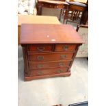 A 19TH CENTURY STYLE MAHOGANY CHEST OF TWO SHORT AND THREE LONG GRADUATED DRAWERS, 31" WIDE