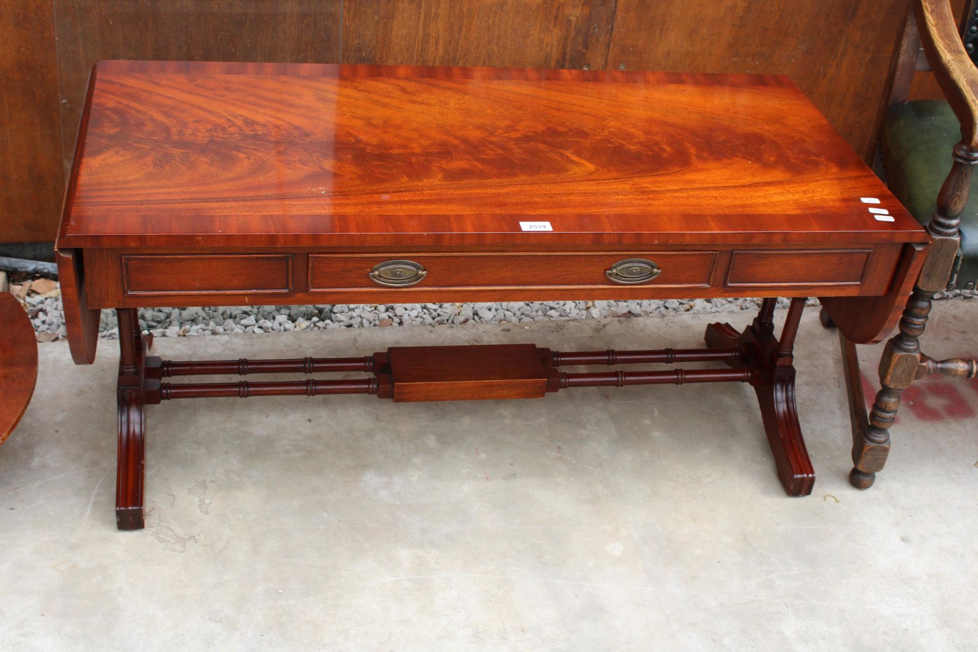 A REPRODUCTION WADE (NO. 16) MAHOGANY AND CROSS BANDED DROP-LEAF COFFEE TABLE WITH ORIGINAL £870