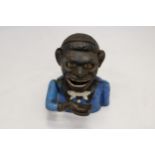 A VINTAGE CAST IRON AFRICAN AMERICAN MECHANICAL BANK