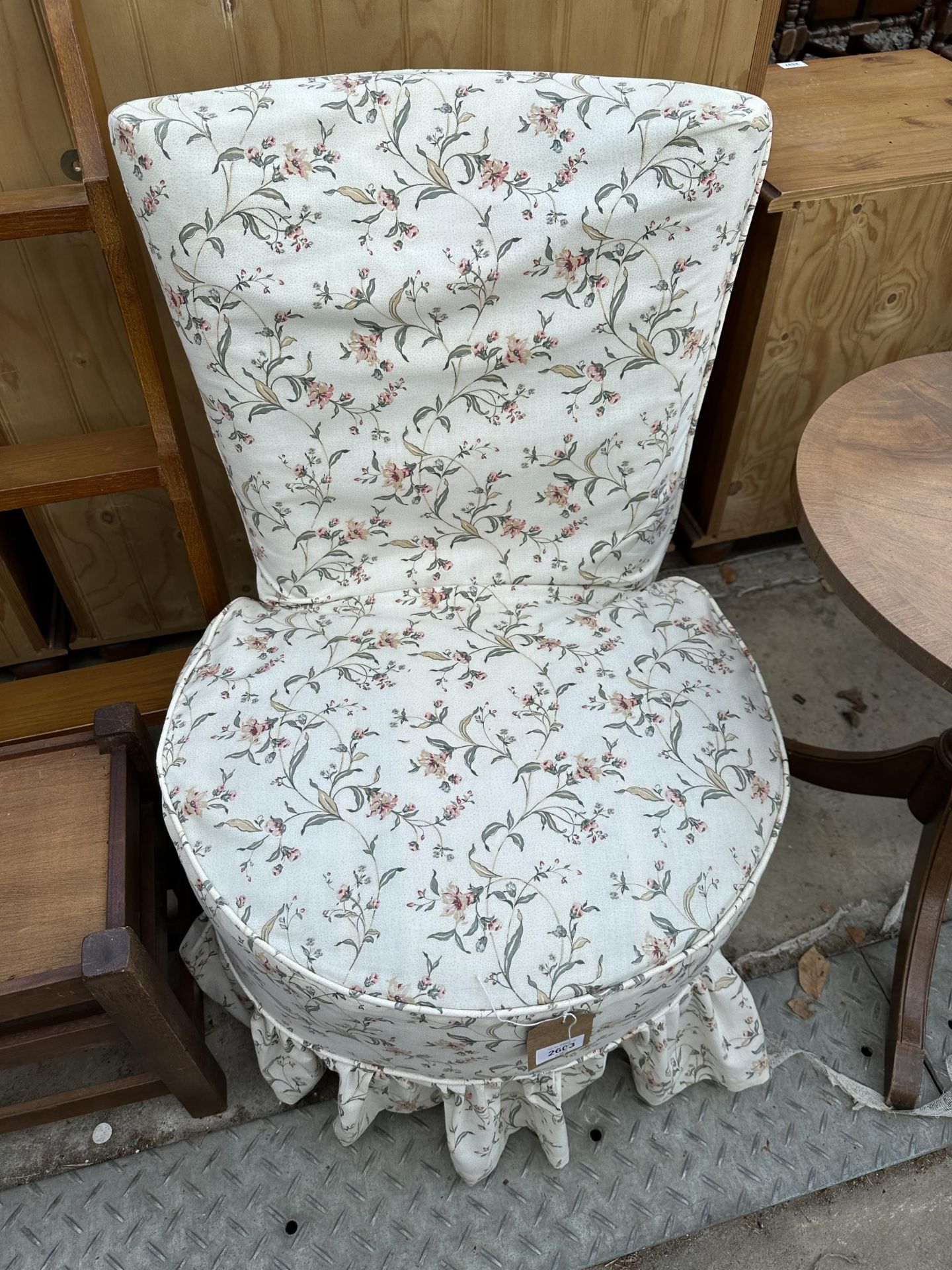 A MODERN FLORAL BEDROOM CHAIR