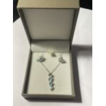 A SILVER NECKLACE AND EARRING SET WITH AQUAMARINE COLOURED STONES IN A PRESENTATION BOX
