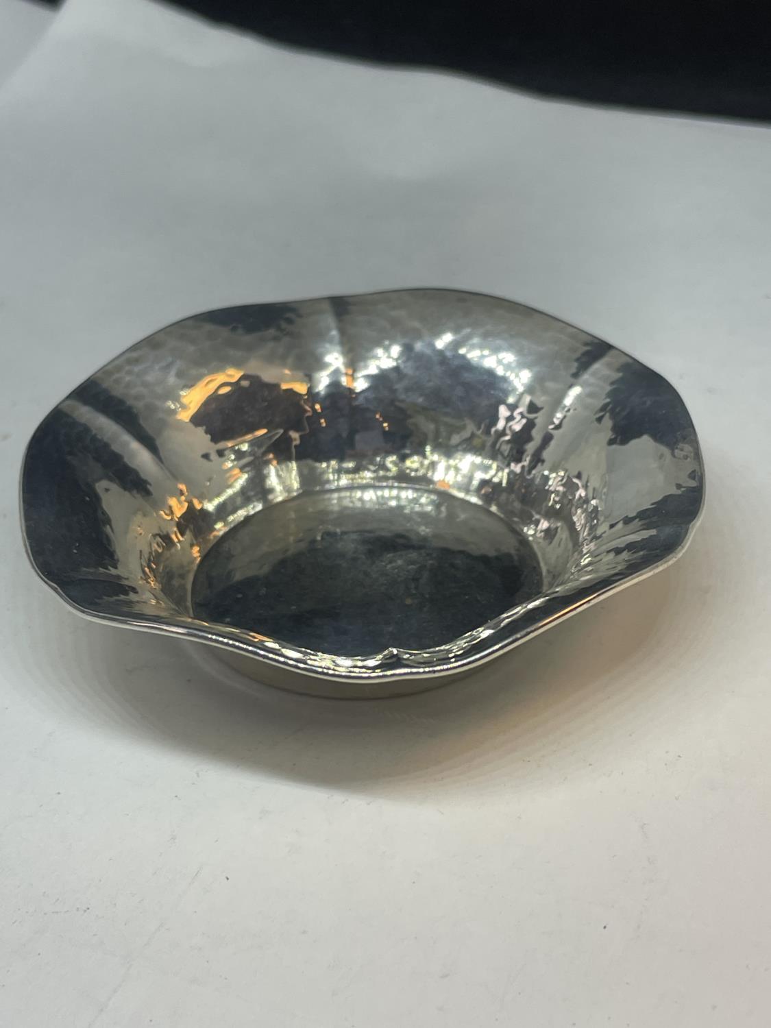 A STERLING SILVER CIRCULAR DISH