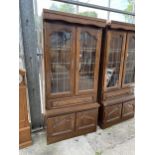 AN OAK CABINET WITH GLAZED AND LEADED UPPER PORTION, 37" WIDE