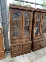 AN OAK CABINET WITH GLAZED AND LEADED UPPER PORTION, 37" WIDE