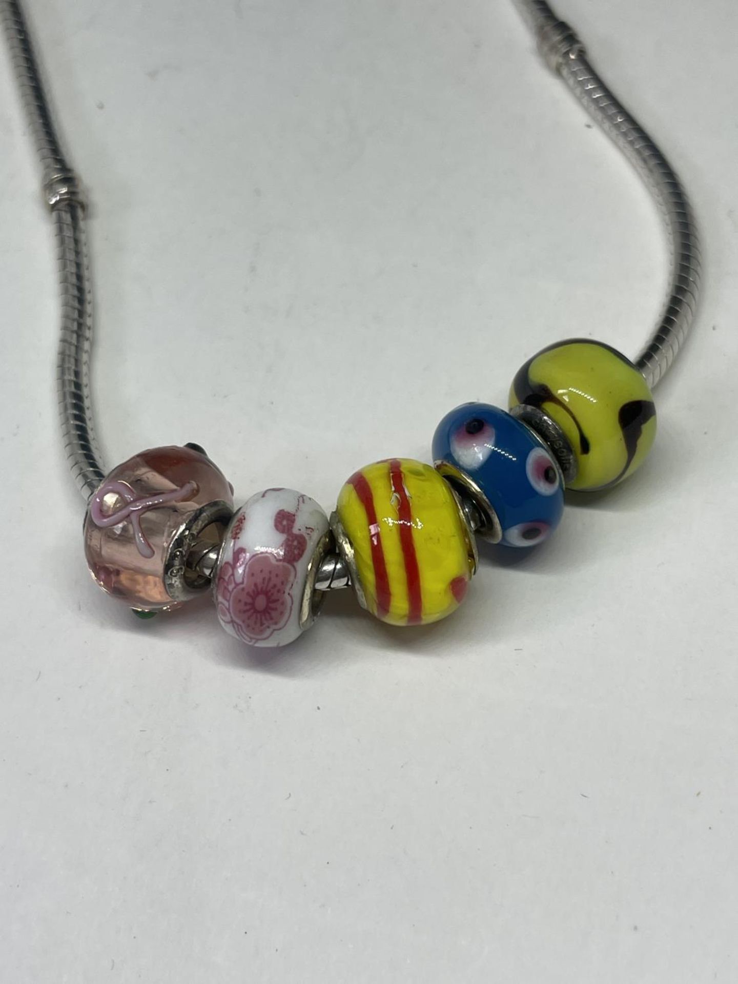 A SILVER PANDORA NECKLACE WITH FIVE GLASS CHARMS - Image 2 of 3
