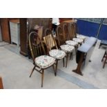 A SET OF SIX ERCOL WINDSOR STYLE DINING CHAIRS AND OVAL GATE-LEG DINING TABLE - 54" X 50" OPENED