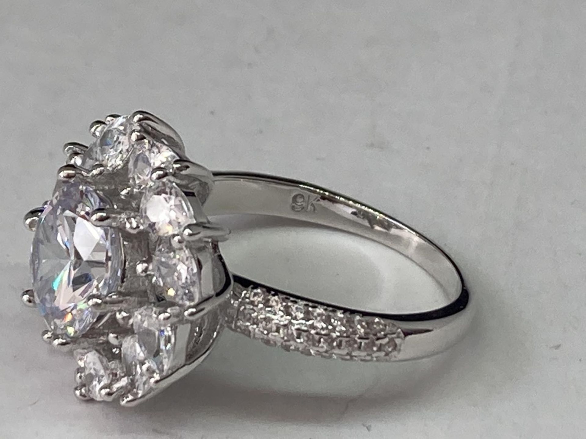 A WHITE METAL RING WITH 3 CARATS OF MOISSANITE IN A CLUSTER DESIGN SIZE Q - Image 4 of 6