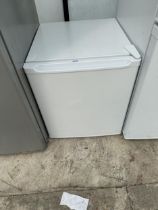 A WHITE COUNTER TOP FRIDGE