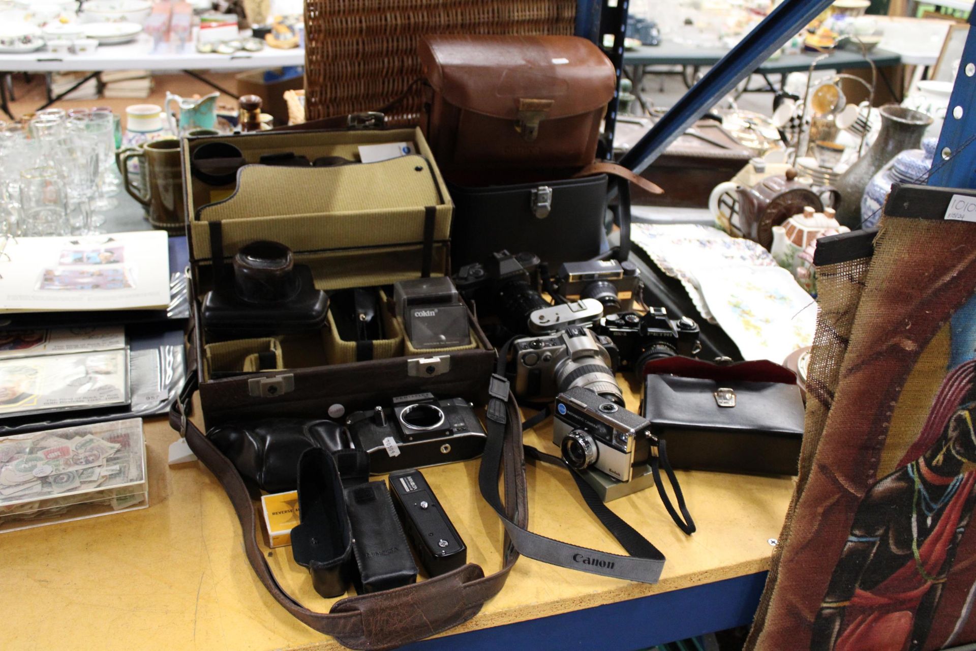 A LARGE COLLECTION OF VINTAGE CAMERAS AND ACCESSORIES TO INCLUDE, CANON EOS 1X, PENTAFLEX SL,