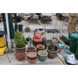 AN ASSORTMENT OF GLAZED AND TERRACOTTA PLANT POTS