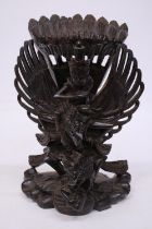 A WOOD CARVING OF GARUDA WITH THE GOD VISHNU - 29 CM (H)