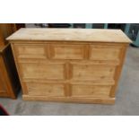 A PINE CHEST OF THREE SHORT AND FOUR LONG DRAWERS, 56" WIDE