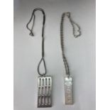 TWO SILVER NECKLACES WITH SILVER INGOT PENDANTS