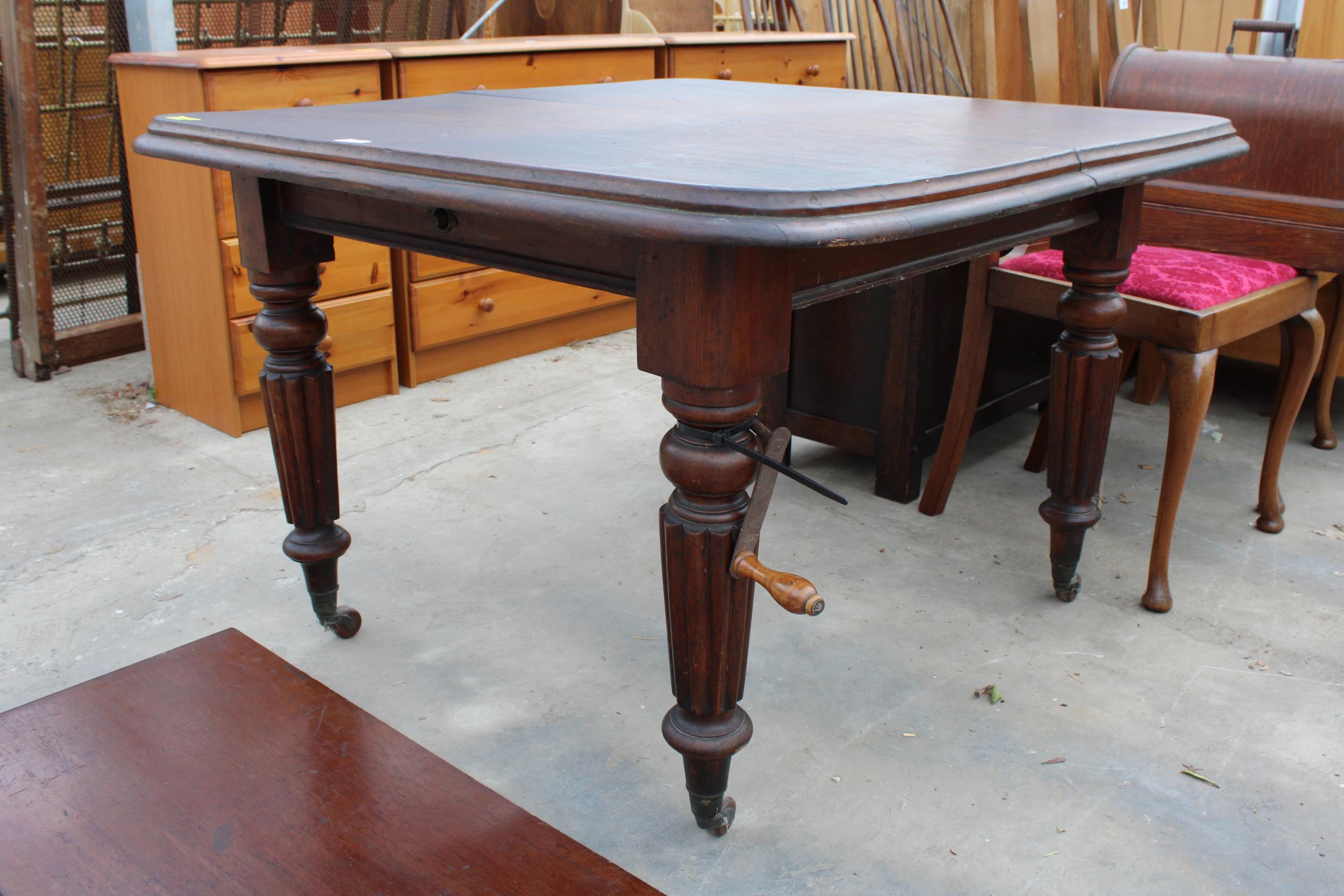 A VICTORIAN MAHOGANY WIND-OUT DINING TABLE ON FLUTED LEGS, 41" SQUARE (LEAF 17") COMPLETE WITH - Image 2 of 3