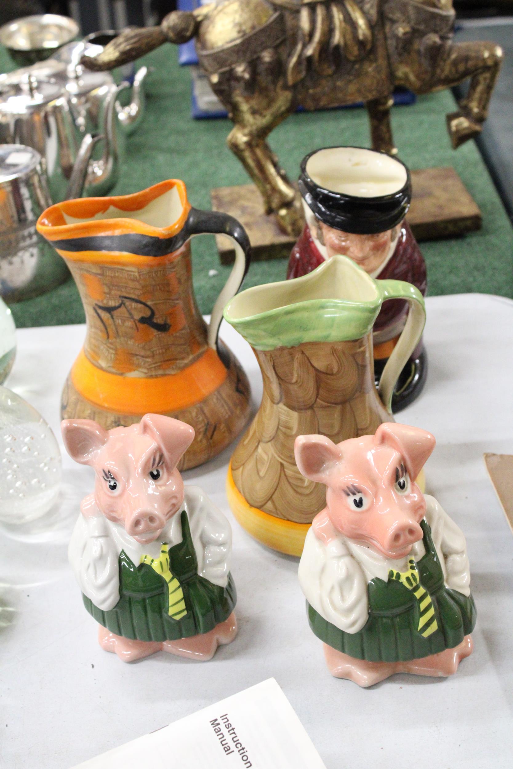 TWO VINTAGE WADE NAT WEST PIGGY BANKS, A ROYAL DOULTON, 'THE HUNTSMAN' TOBY JUG PLUS TWO STUDIO