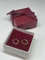 A PAIR OF 9 CARAT GOLD LOOP EARRINGS IN A PRESENTATION BOX