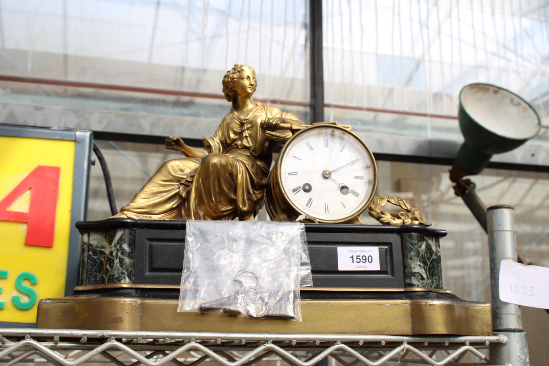 A VINTAGE SLATE CHIMING MANTLE CLOCK WITH BRASS FEMALE FIGURE (COMPLETE WITH WINDING KEY)