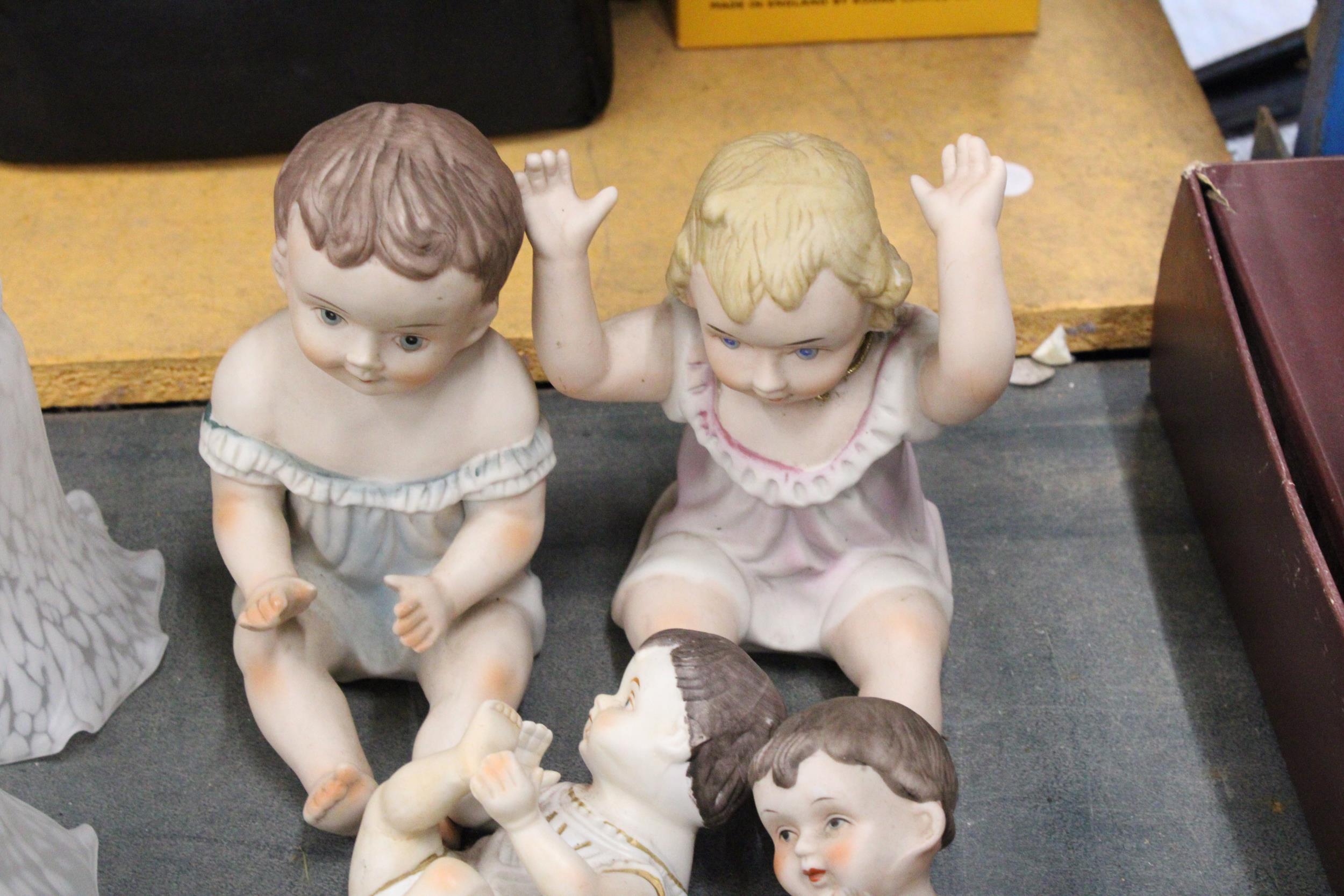 TWO LARGE AND FOUR SMALL ANTIQUE PORCELAIN BISQUE DOLLS - Image 4 of 4