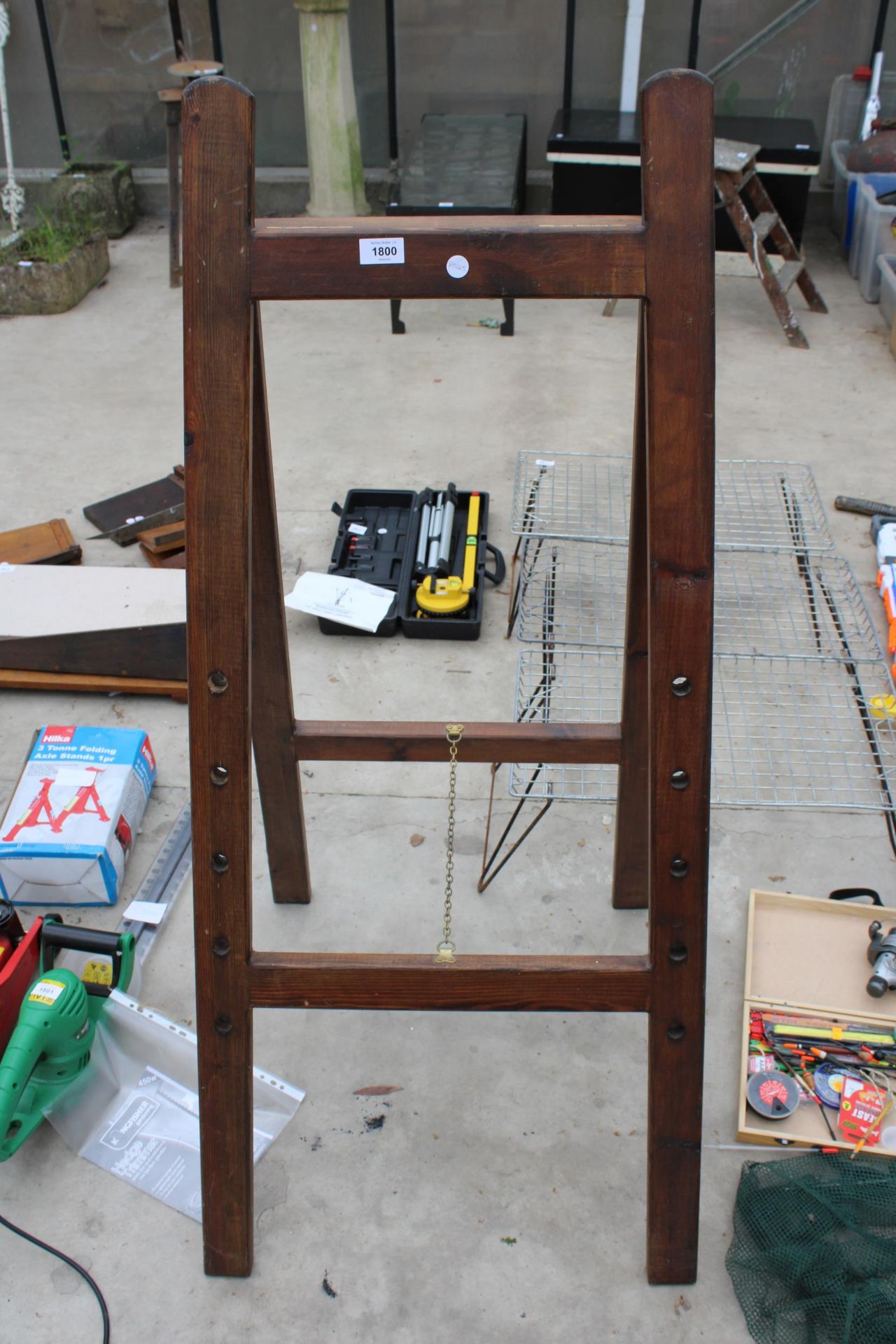 A WOODEN FOLDING EASEL