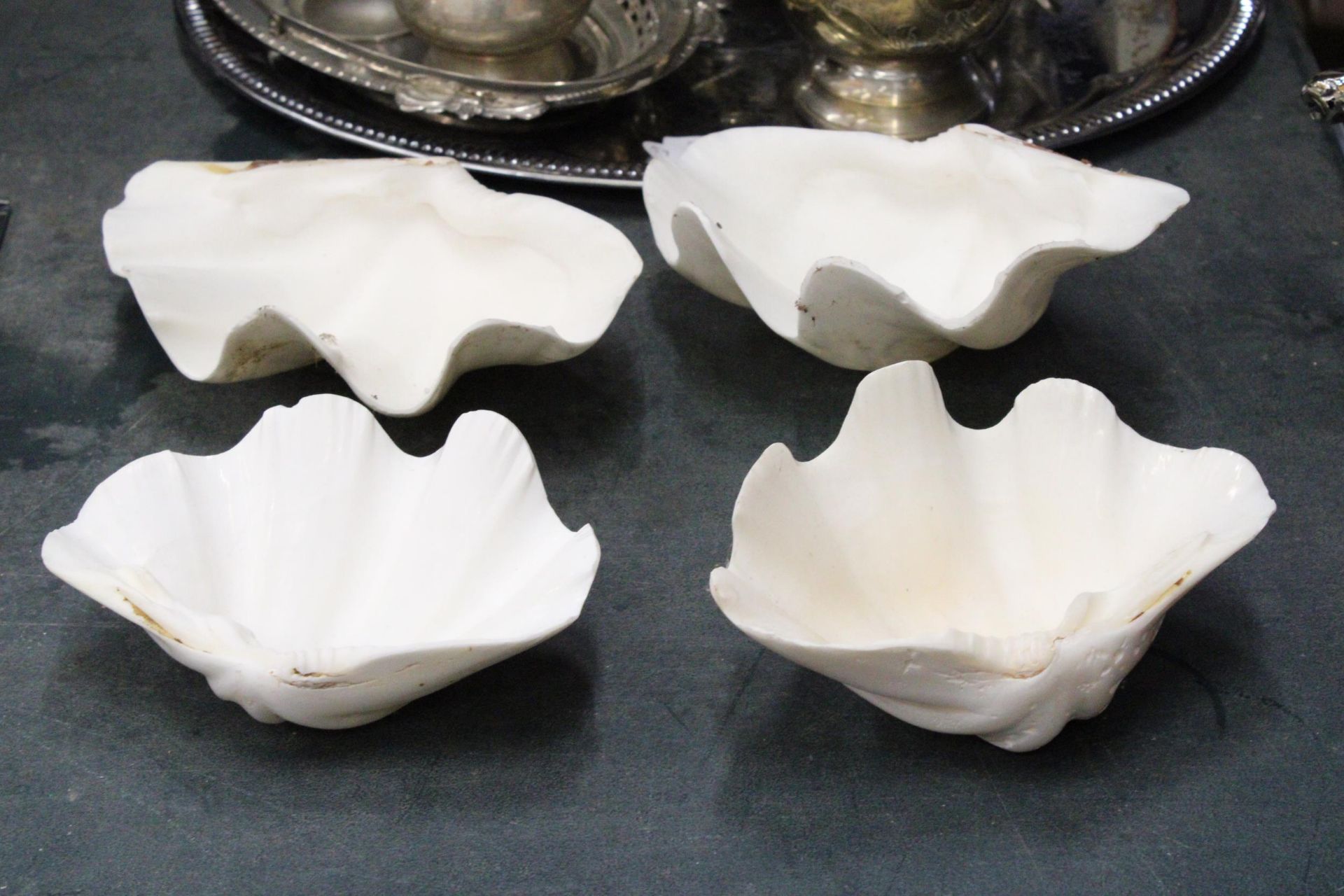 FOUR CERAMIC CLAM SHELL DISHES