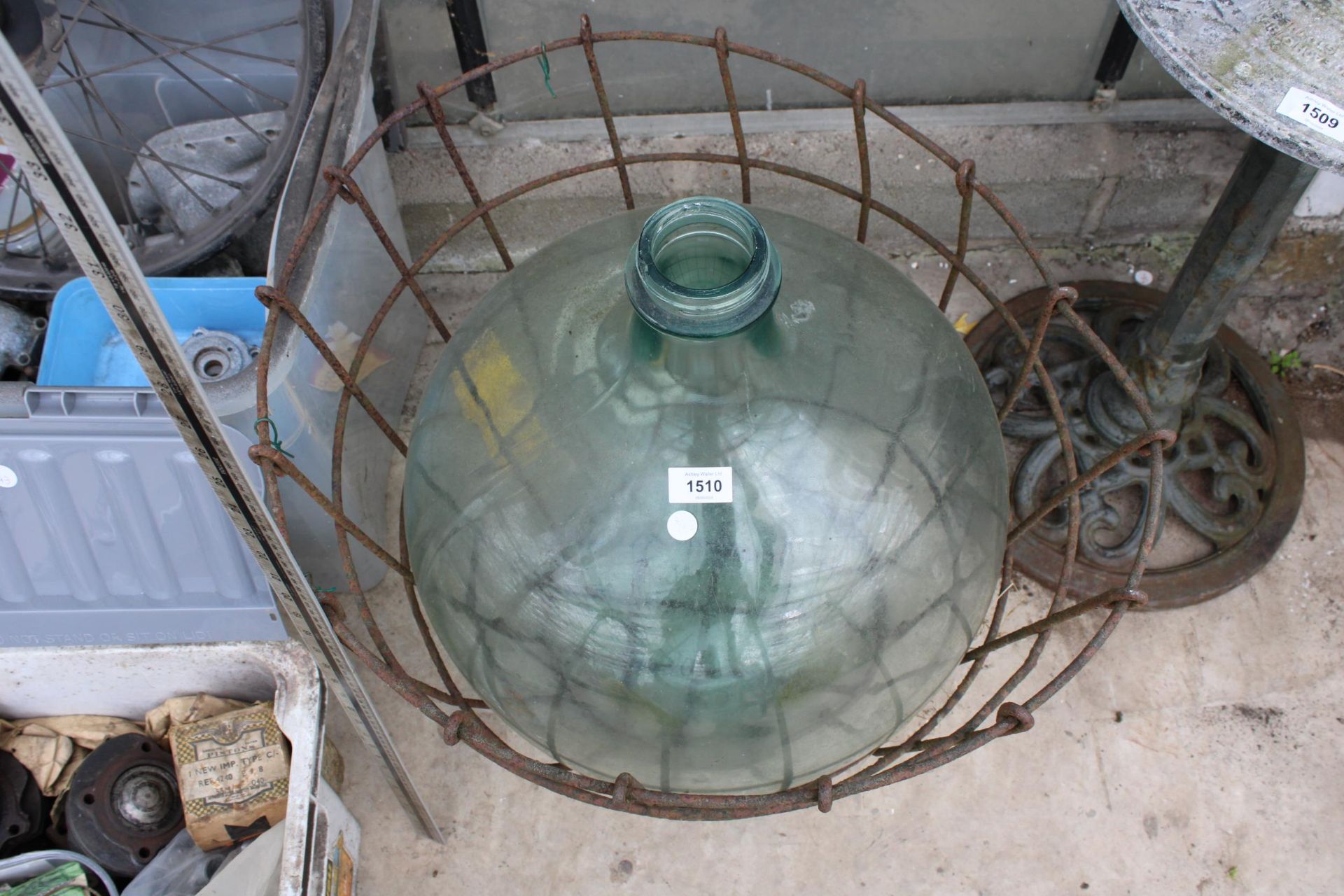 A LARGE VINTAGE GLASS CARBOY WITH WIRE CRATE - Image 2 of 2