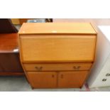 A RETRO TEAK BUREAU WITH CUPBOARDS AND SINGLE DRAWER TO BASE, 33" WIDE