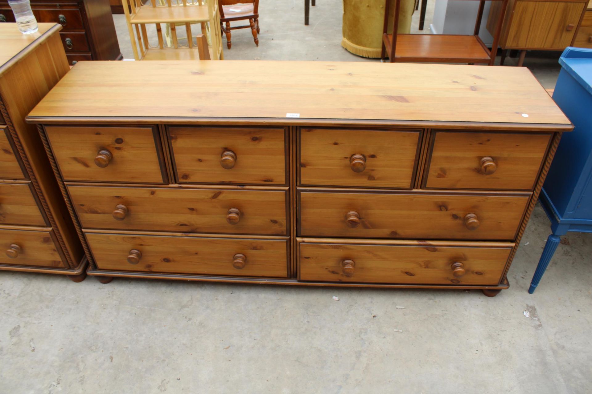 A MODERN PINE CHEST OF FOUR SHORT AND FOUR LONG DRAWERS, 66" WIDE