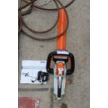 A STIHL HSA 45 BATTERY HEDGE TRIMMER WITH CHARGER AND MANUAL