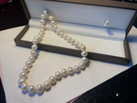 A STRING OF JIEBEI CULTURED PEARLS IN A PRESENTATION BOX