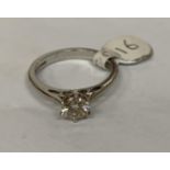 A LADIES' HALF CARAT DIAMOND AND PLATINUM RING