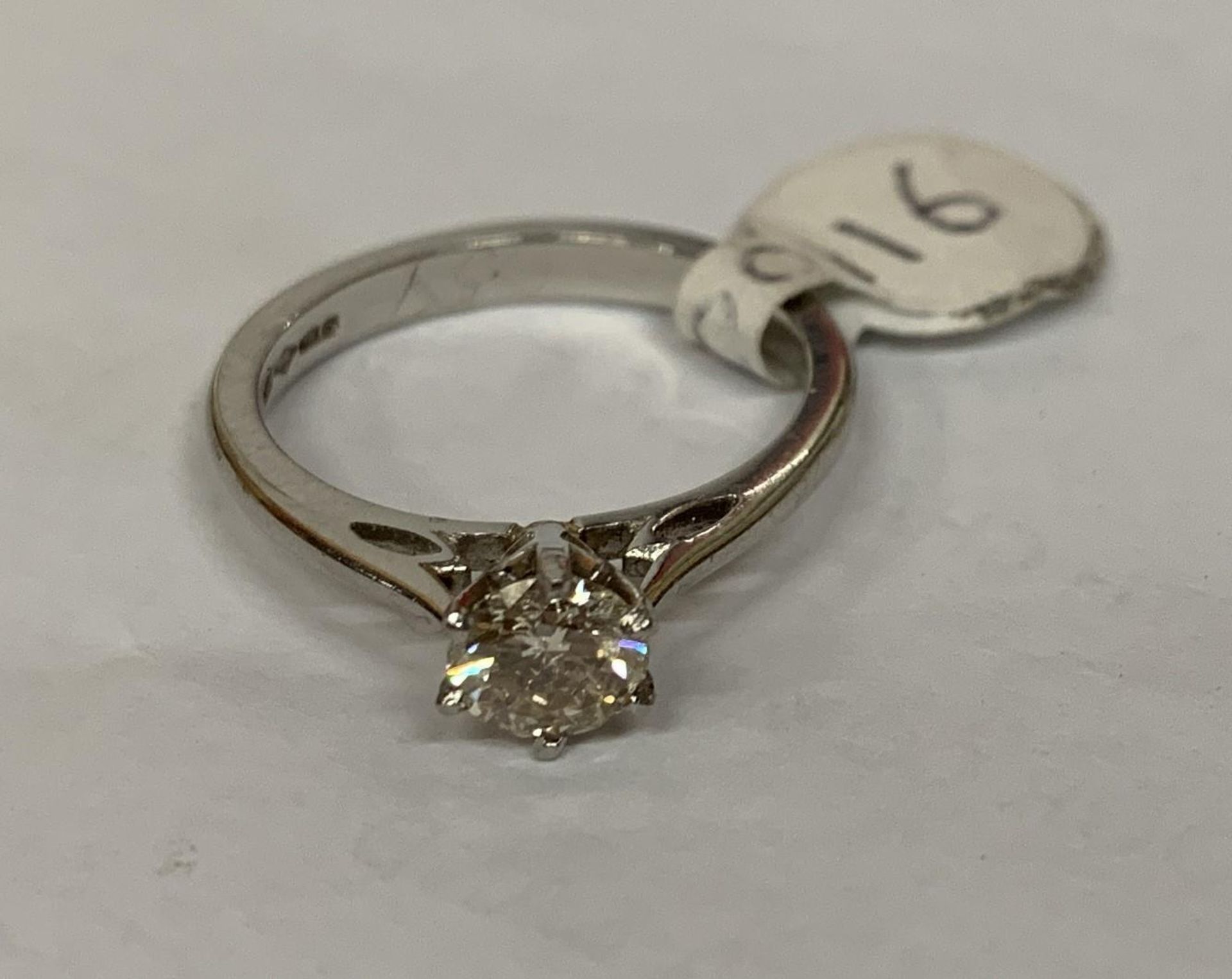 A LADIES' HALF CARAT DIAMOND AND PLATINUM RING