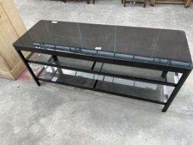 A MODERN METALWARE BLACK THREE TIER GLASS TABLE, 47" WIDE