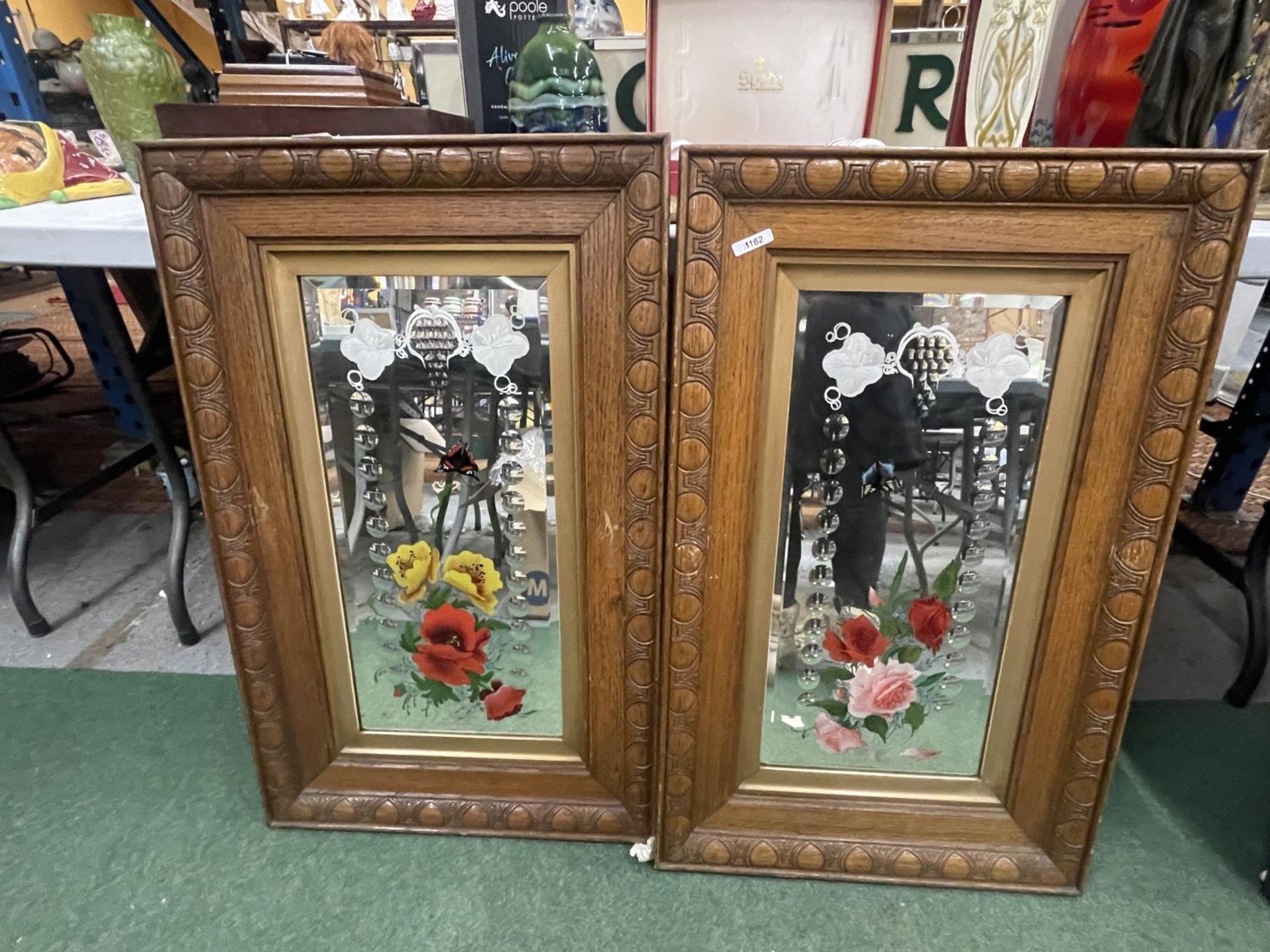 TWO OAK FRAMED DECORATIVE MIRRORS WITH FLOWERS AND BUTTERFLIES 20" X 33"