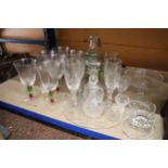 A LARGE QUANTITY OF GLASSWARE TO INCLUDE WINE GLASSES, VINEGAR BOTTLE WITH STOPPER, CHEESEBOARD,